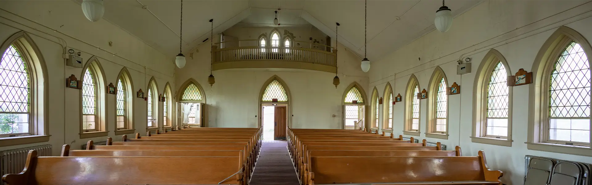 Large Church Interior With Wooden Pews
