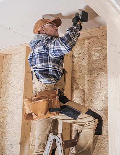 Home Contractor Installing Ceiling Drywall