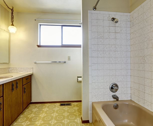 Outdated Bathroom With Tub And Tile Ready For Remodel